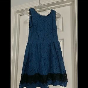 Blue lace dress with black trim